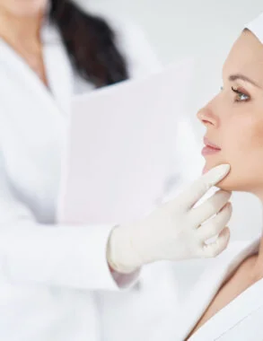 Doctor checking a patient's chin