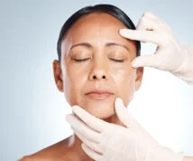 Botox, mature woman and doctor hands check face for plastic surgery and beauty consultation. Skincare, beauty and facial change for medical and aesthetic transformation with dermatology and filler